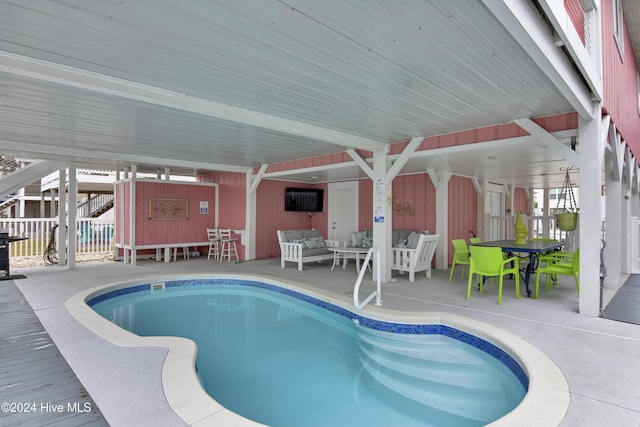 25 Newport St, Ocean Isle Beach, NC 28469 - indoor pool featuring an outdoor living space and a patio area