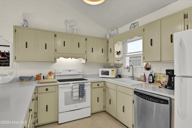 25 Newport St, Ocean Isle Beach, NC 28469 - kitchen with white appliances, cream cabinetry, a sink, lofted ceiling, and light countertops