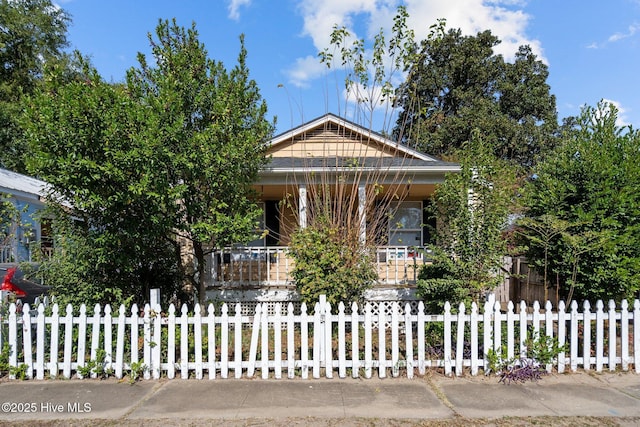 view of front facade with a fenced front yard and a porch