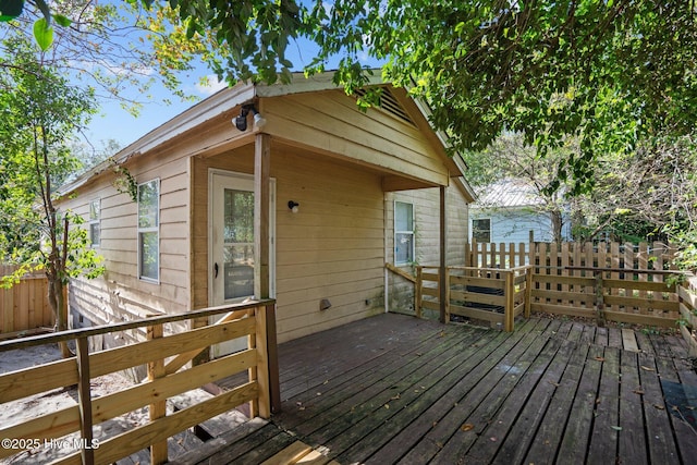 wooden deck featuring fence