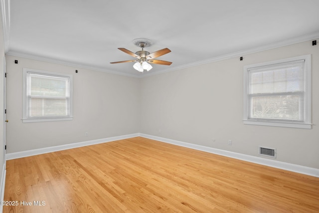 unfurnished room featuring light hardwood / wood-style flooring, ceiling fan, and crown molding