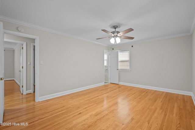 unfurnished room featuring ceiling fan, light hardwood / wood-style floors, and crown molding