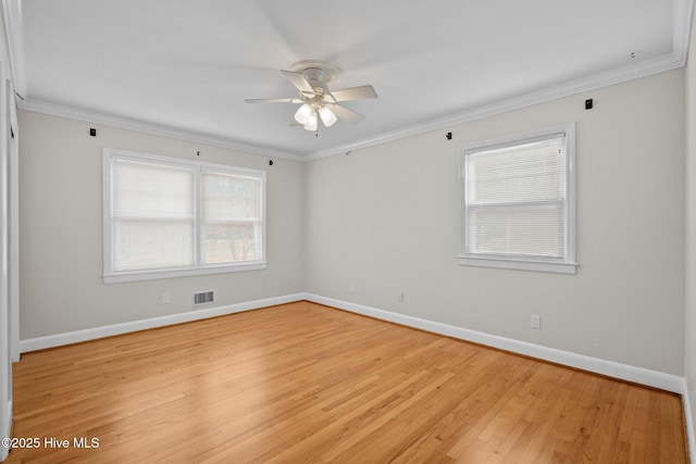 spare room featuring crown molding, light hardwood / wood-style flooring, and ceiling fan