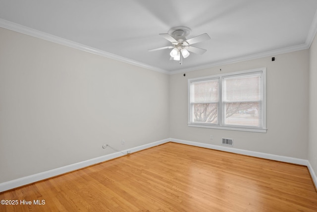 spare room with light wood-type flooring, ceiling fan, and ornamental molding