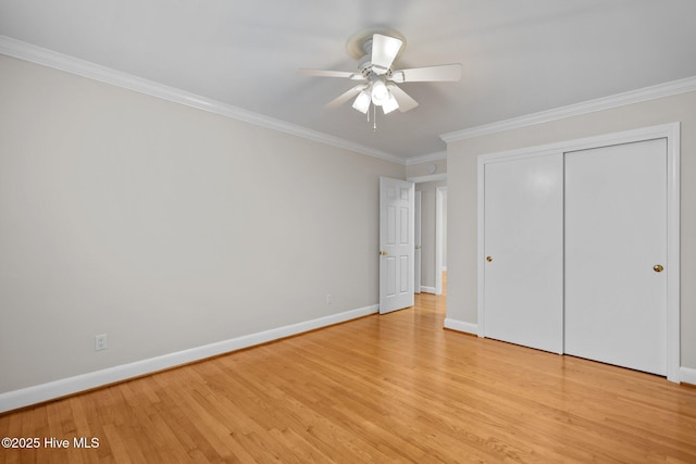 unfurnished bedroom featuring ceiling fan, a closet, light hardwood / wood-style floors, and ornamental molding