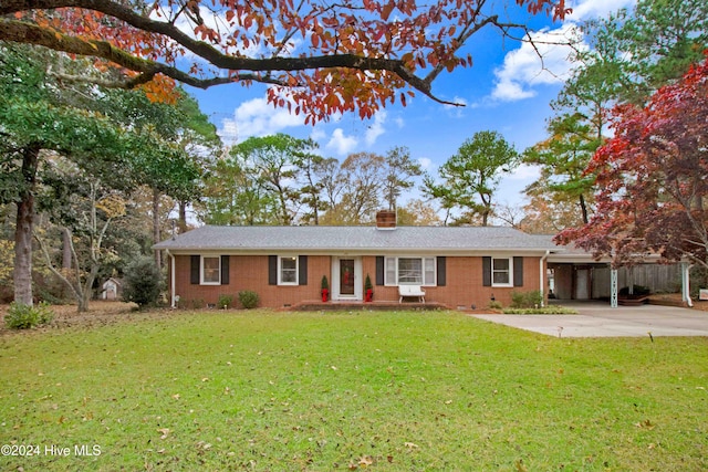 ranch-style house with a carport and a front yard