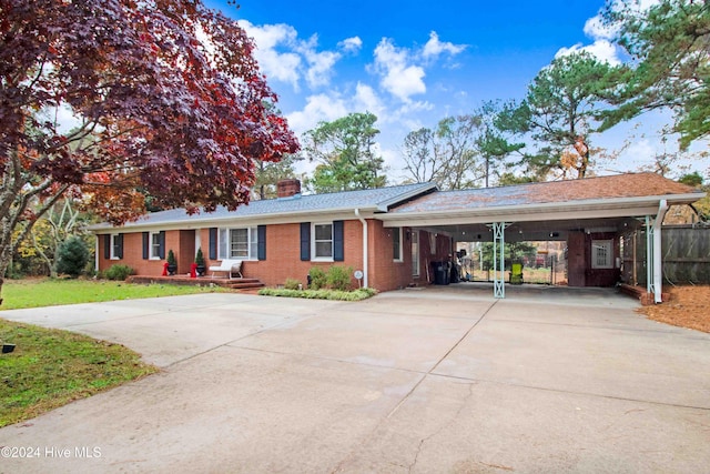 ranch-style home featuring a carport