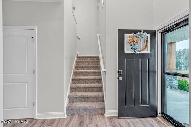 entryway with light hardwood / wood-style floors