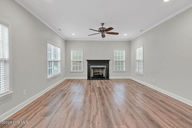 unfurnished living room with ceiling fan, light hardwood / wood-style floors, and ornamental molding