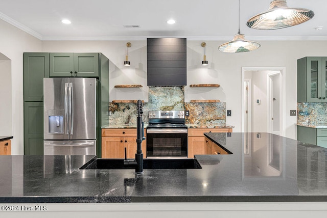 kitchen with decorative backsplash, stainless steel appliances, green cabinetry, and crown molding