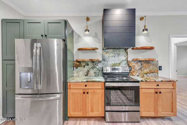 kitchen with light stone counters, light hardwood / wood-style floors, decorative light fixtures, and appliances with stainless steel finishes