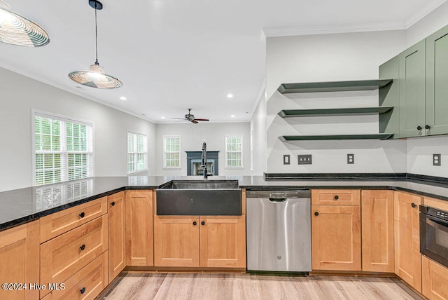 kitchen featuring ceiling fan, dishwasher, light hardwood / wood-style floors, black oven, and ornamental molding