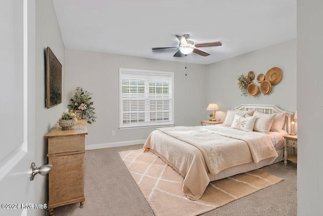 bedroom featuring ceiling fan and light carpet