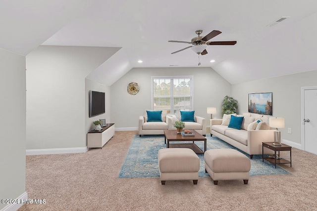 carpeted living room featuring ceiling fan and vaulted ceiling