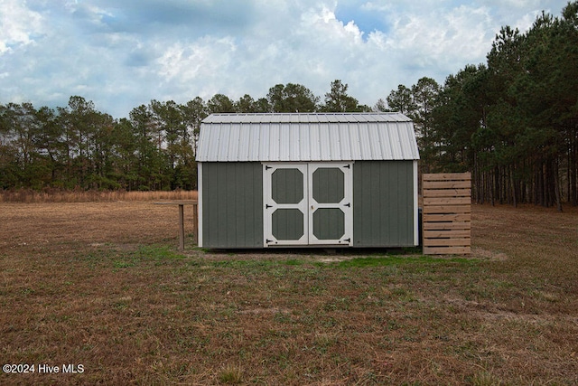 view of outbuilding with a lawn