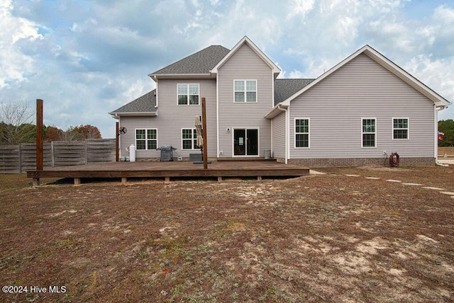 rear view of property with a wooden deck