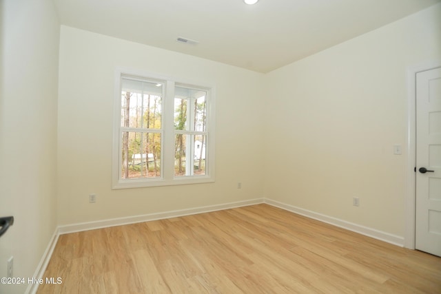 unfurnished room with light hardwood / wood-style floors