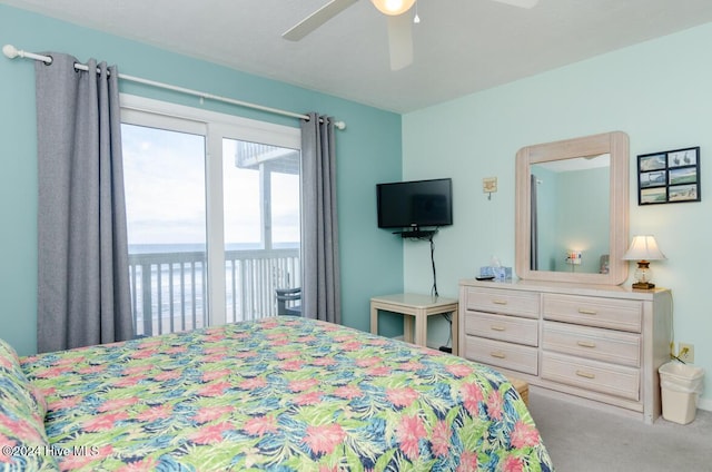 bedroom with access to exterior, ceiling fan, and light carpet