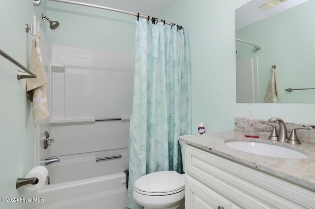 full bathroom with toilet, vanity, and shower / tub combo with curtain