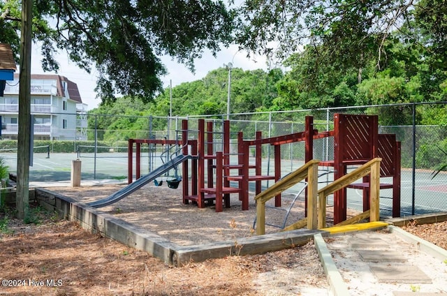 view of playground featuring tennis court