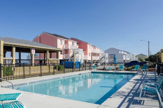 view of swimming pool with a gazebo and a patio