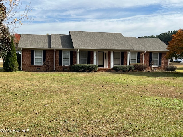 ranch-style home with a front yard