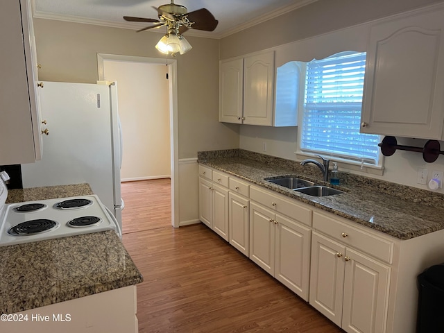 kitchen featuring white cabinets, ornamental molding, and sink