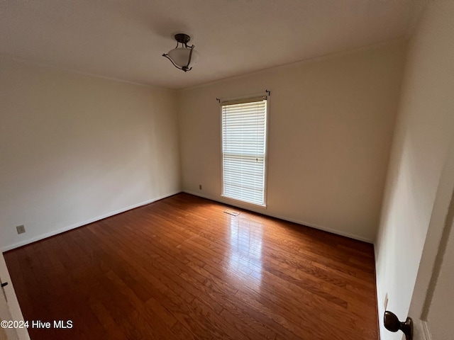 unfurnished room featuring wood-type flooring