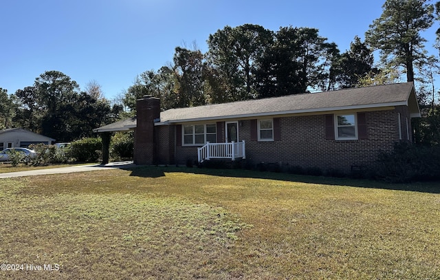 single story home featuring a front yard, crawl space, brick siding, and a chimney