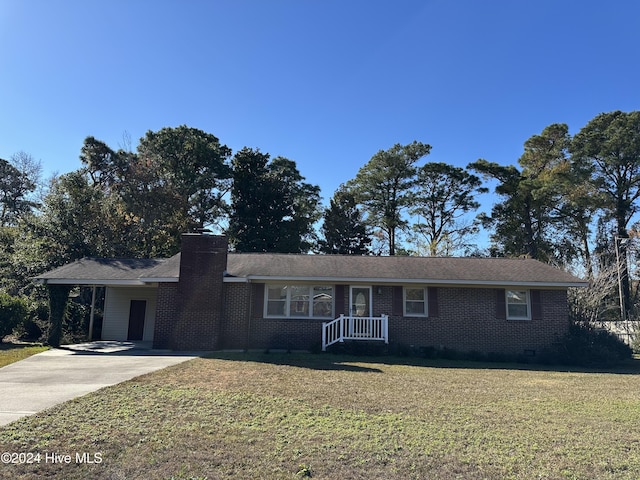 ranch-style house with driveway, a chimney, crawl space, a front lawn, and brick siding