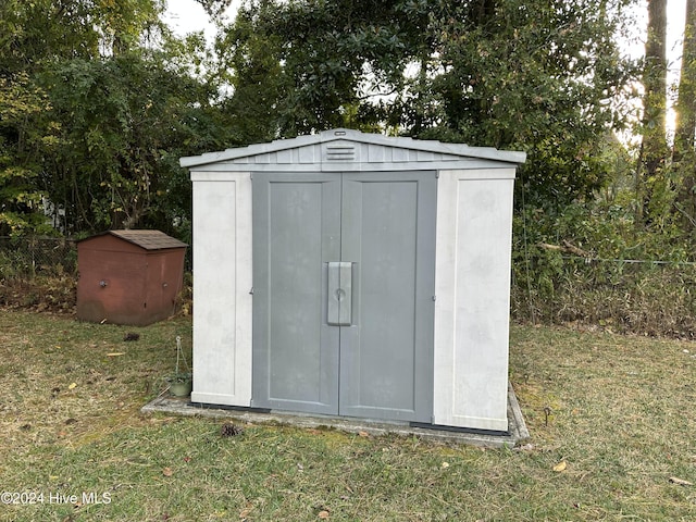 view of outbuilding featuring a yard