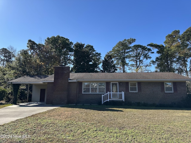 ranch-style house with a carport and a front yard