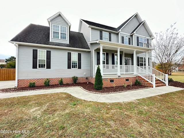 view of front of house featuring a front lawn and a porch