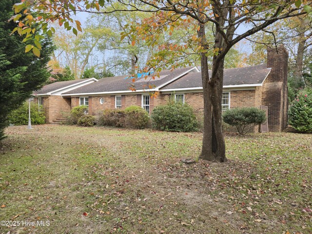 view of home's exterior featuring a lawn