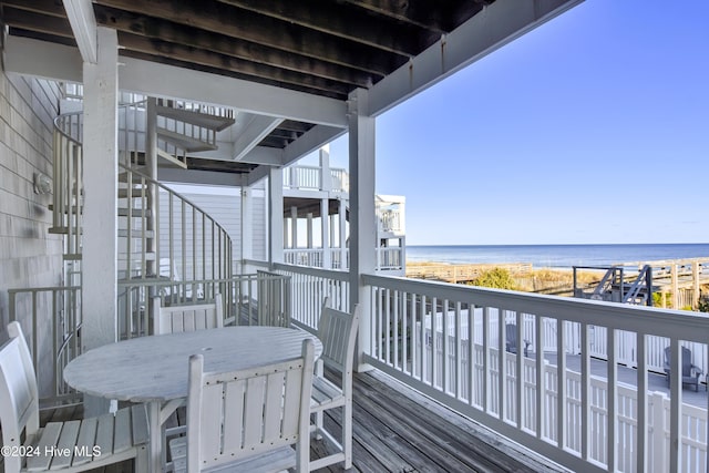 balcony featuring a water view