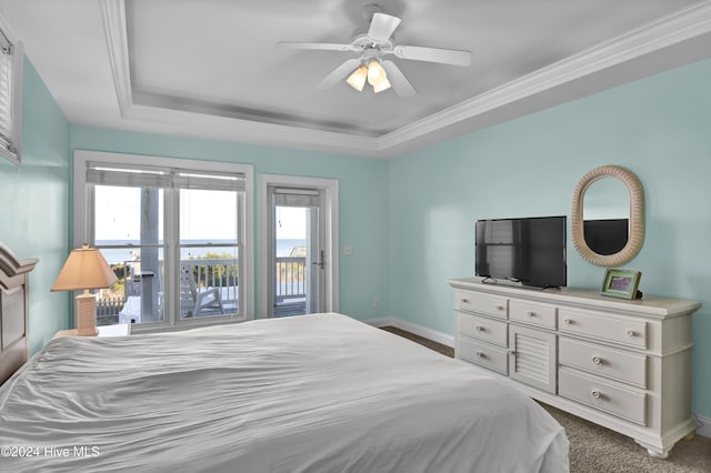 bedroom with crown molding, ceiling fan, access to exterior, dark colored carpet, and a raised ceiling