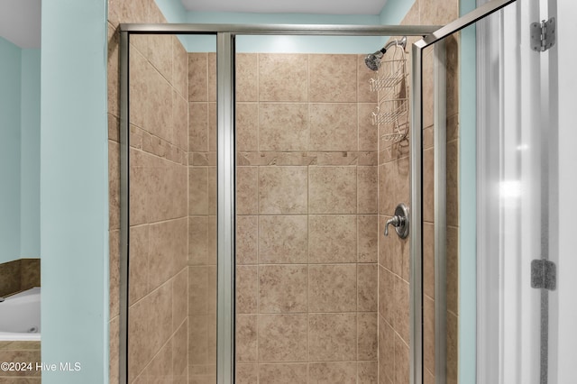 bathroom with separate shower and tub