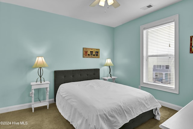 carpeted bedroom with ceiling fan