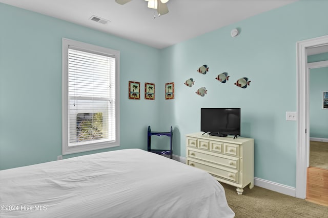 bedroom with light carpet and ceiling fan