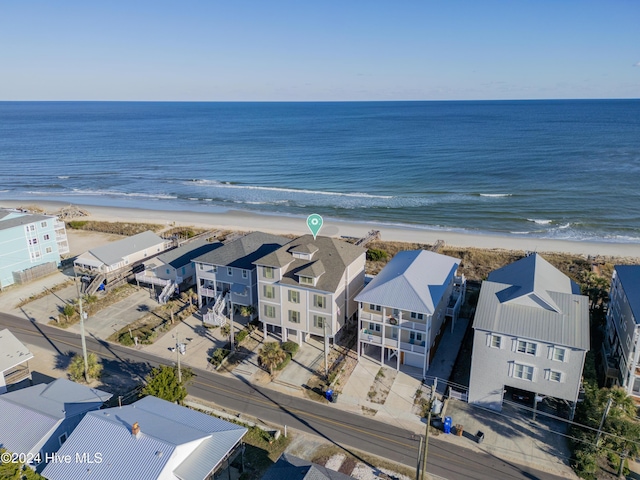 drone / aerial view with a view of the beach and a water view