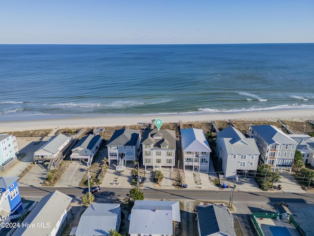 bird's eye view featuring a view of the beach and a water view