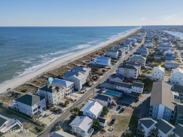 drone / aerial view with a water view and a view of the beach