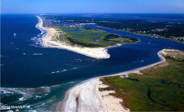 bird's eye view featuring a view of the beach and a water view