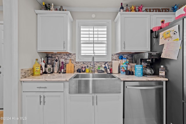 kitchen featuring white cabinetry, sink, stainless steel appliances, tasteful backsplash, and crown molding