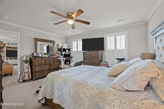 carpeted bedroom with ceiling fan, crown molding, and multiple windows