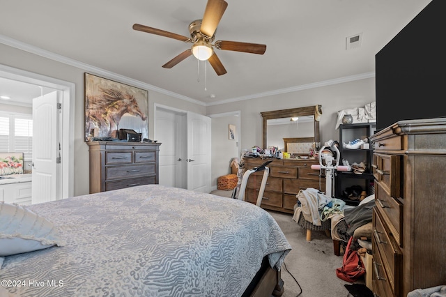 carpeted bedroom with connected bathroom, ceiling fan, and crown molding