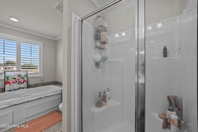 bathroom featuring toilet, crown molding, hardwood / wood-style floors, and shower with separate bathtub