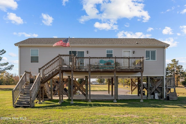 back of house with a lawn, a patio area, and a wooden deck