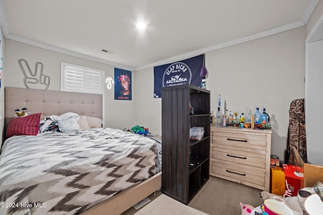 bedroom featuring carpet floors and ornamental molding