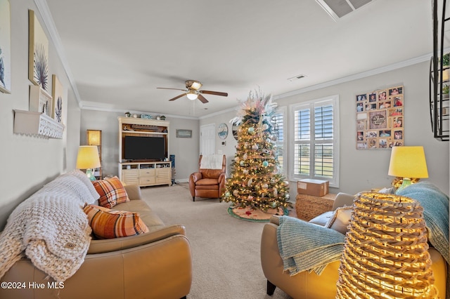 carpeted living room featuring ceiling fan and ornamental molding